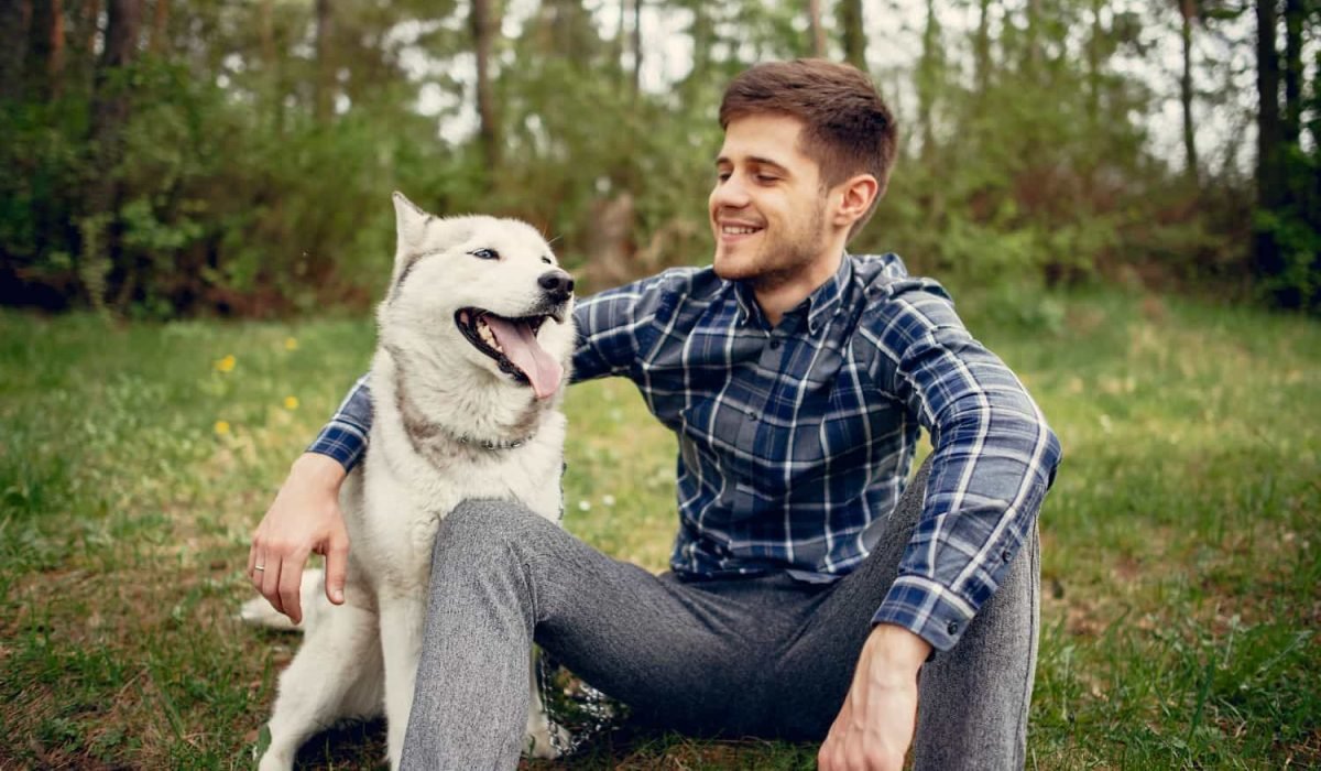 up-handsome-guy-in-a-summer-park-with-a-dog-2023-11-27-05-31-48-utc.jpg