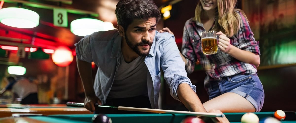 young-couple-playing-snooker-together-in-bar-2021-08-26-17-34-22-utc-min.jpg